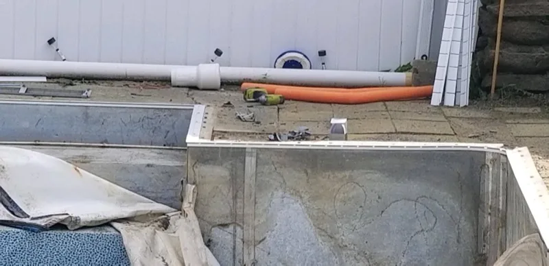 Pool plumbing and equipment work during a pool build