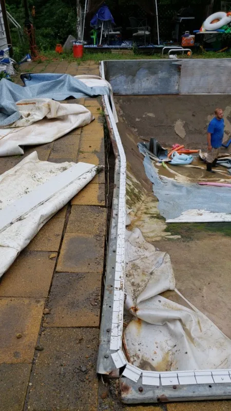 Vinyl liner installation in progress at an in-ground pool